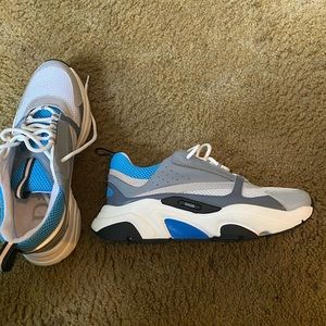 Christian Dior sneakers blue and white gray reflection.